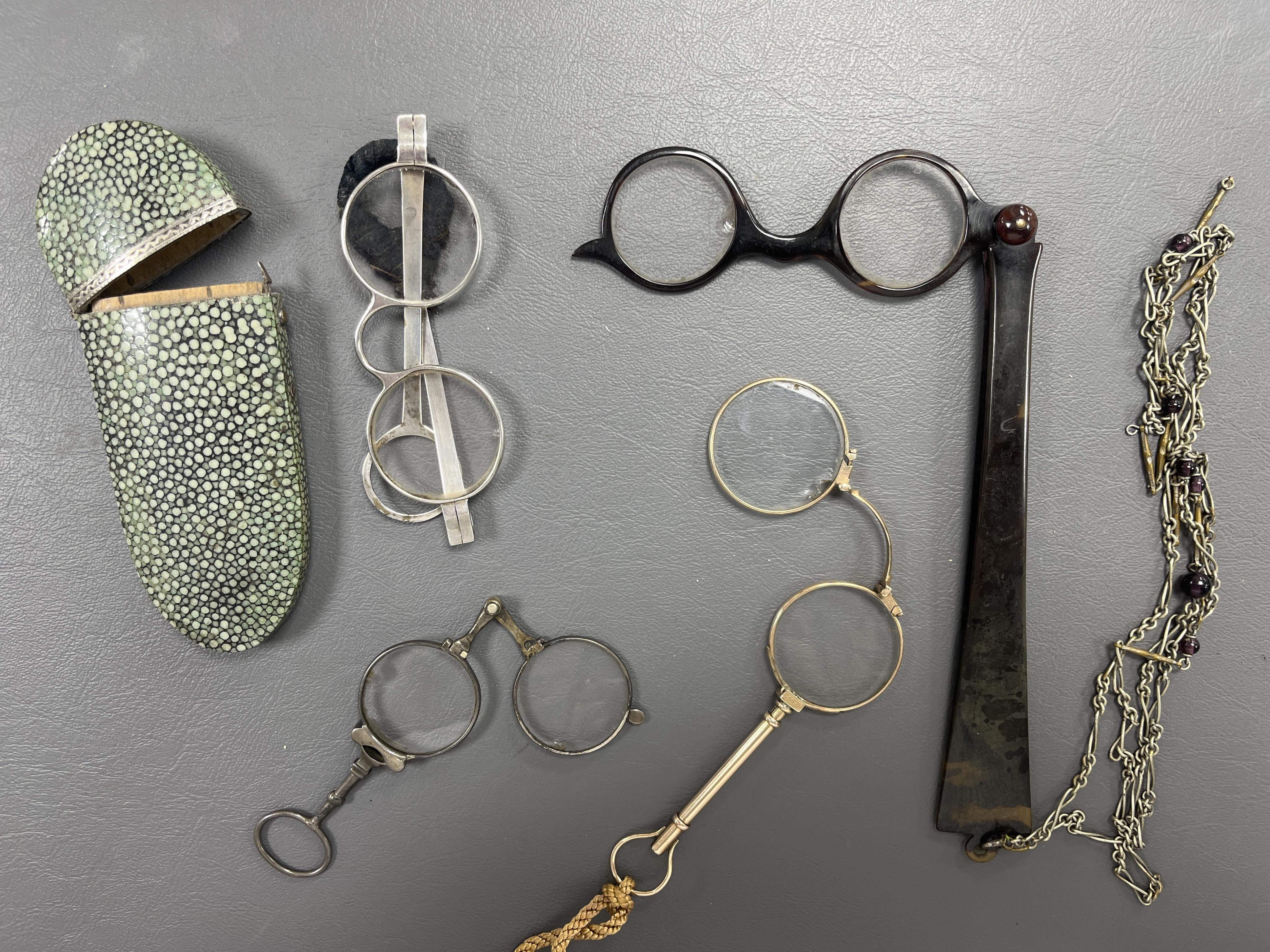 A pair of 18th/19th century shagreen cased white metal temple spectacles, a pair of gold lorgnettes, marked Spiller, London, two other pairs of lorgnettes in tortoiseshell and base metal (4)